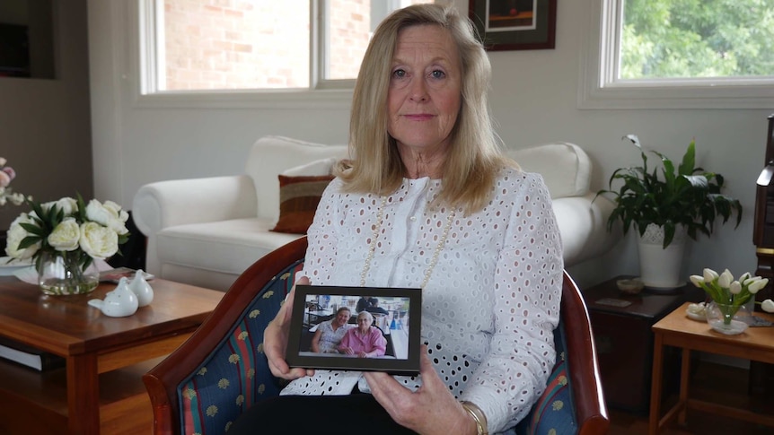 Rosemary Dupont with a photo of her late mother.