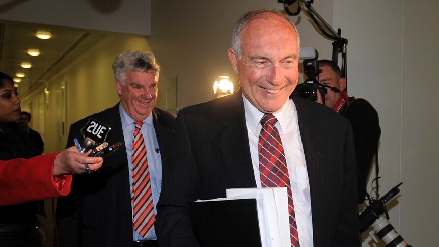 Warren Truss and Senator Ron Boswell arrive at a meeting in Canberra.