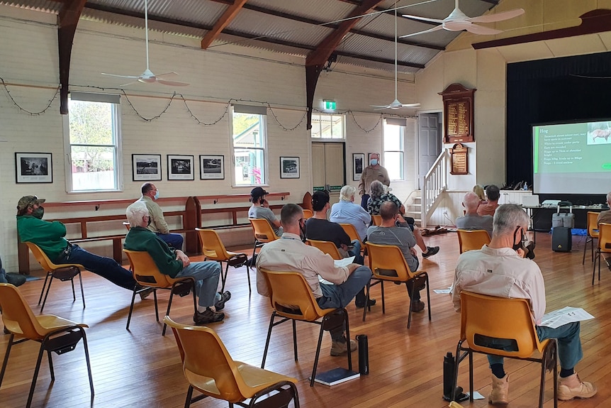 Landholders socially distanced and wearing masks at a workshop.