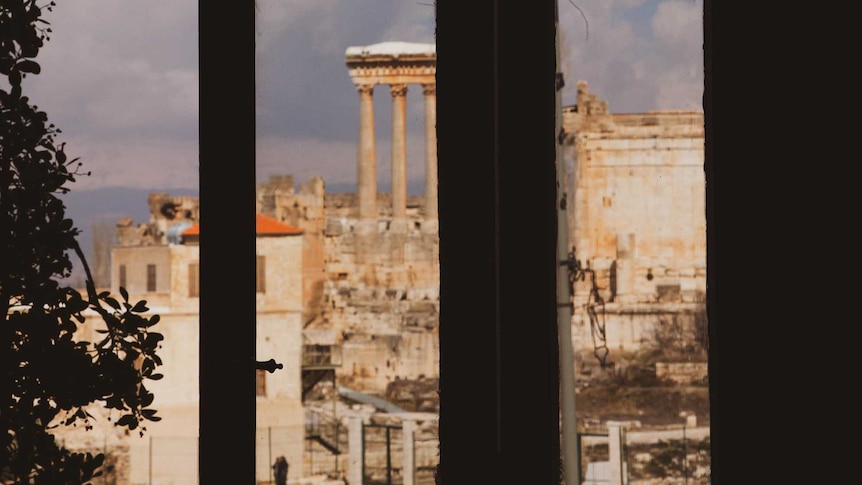 The ruins of Baalbek viewed through a window of the Palmyra Hotel.