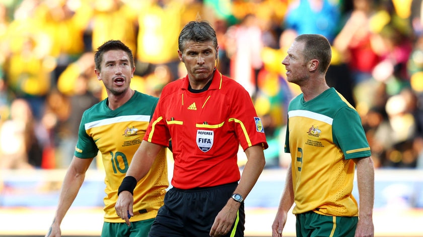 Harry Kewell, on his return to the Socceroos side, was sent off for a handball on the line.
