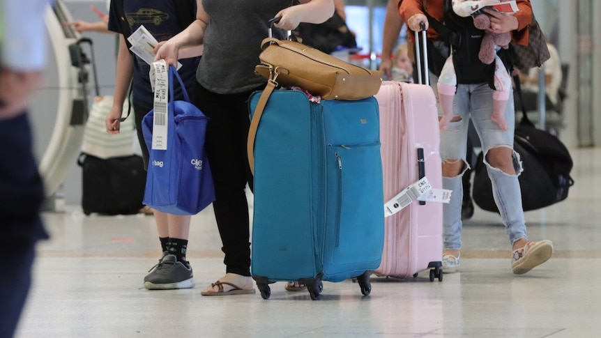 A traveler walks through Brisbane Airport