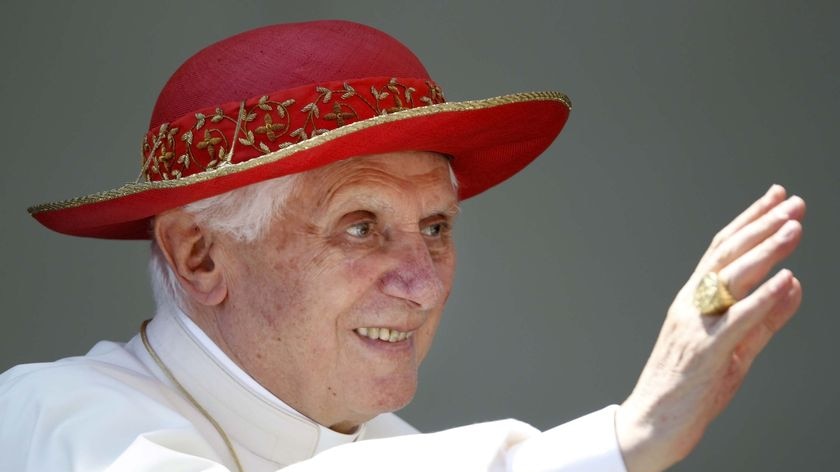 Pope Benedict XVI wears a 'Saturno' hat as he arrives to lead the weekly general audience