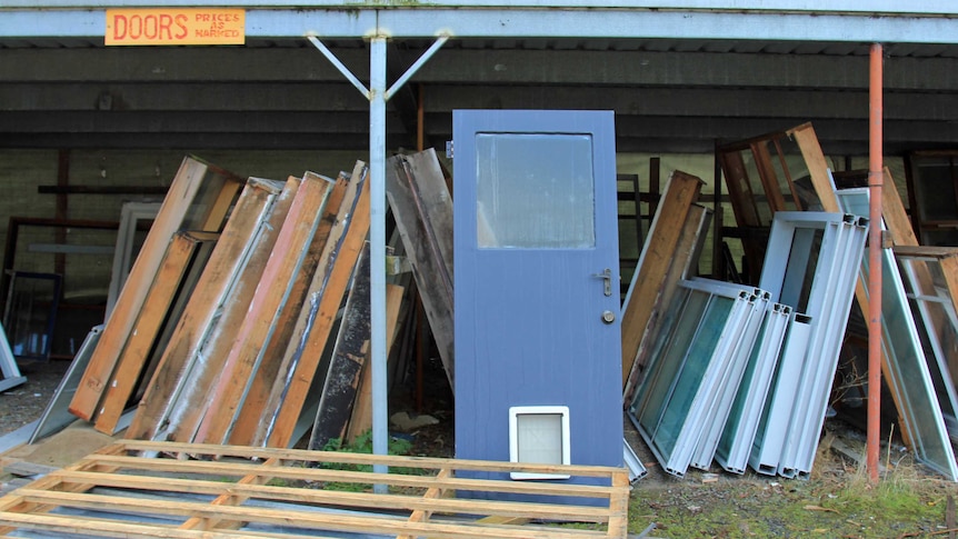 Second hand doors under a car port roof for sale