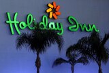 A Holiday Inn sign on the side of one of their hotels