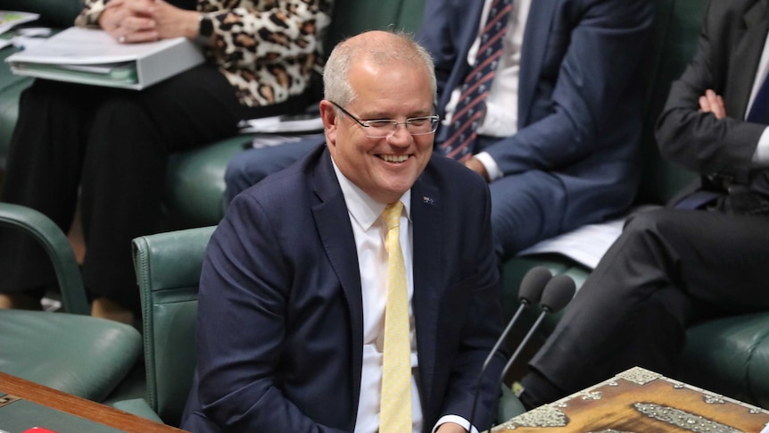 Scott Morrison smiles in the House