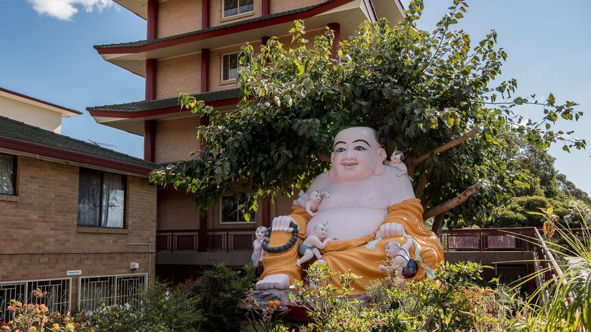 A statue of Budda sits outside a Buddhist Temple in Wetherill Park NSW. Photo taken on October 1 2019