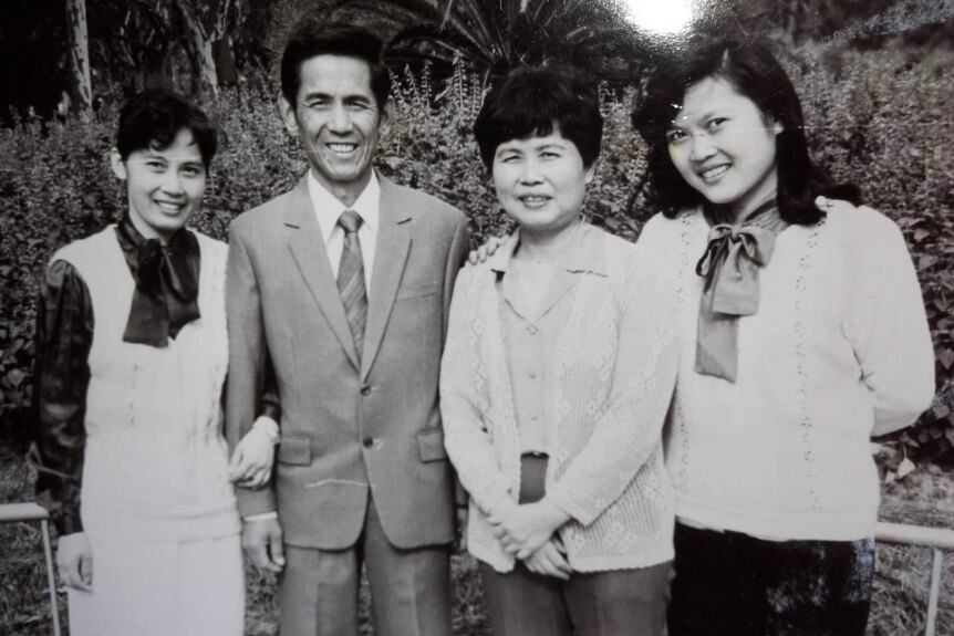 Black and white picture of Yaosheng Zhang, his wife and two daughters.