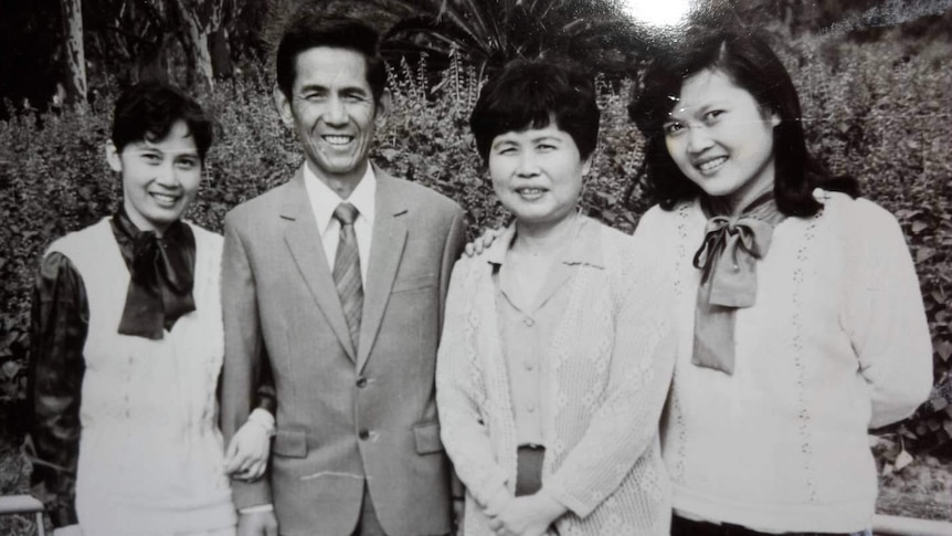 Black and white picture of Yaosheng Zhang, his wife and two daughters.