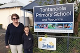 Chair of Tantanoola Primary School's Governing Council Colleen Roberts is standing outside the school with her daughter.