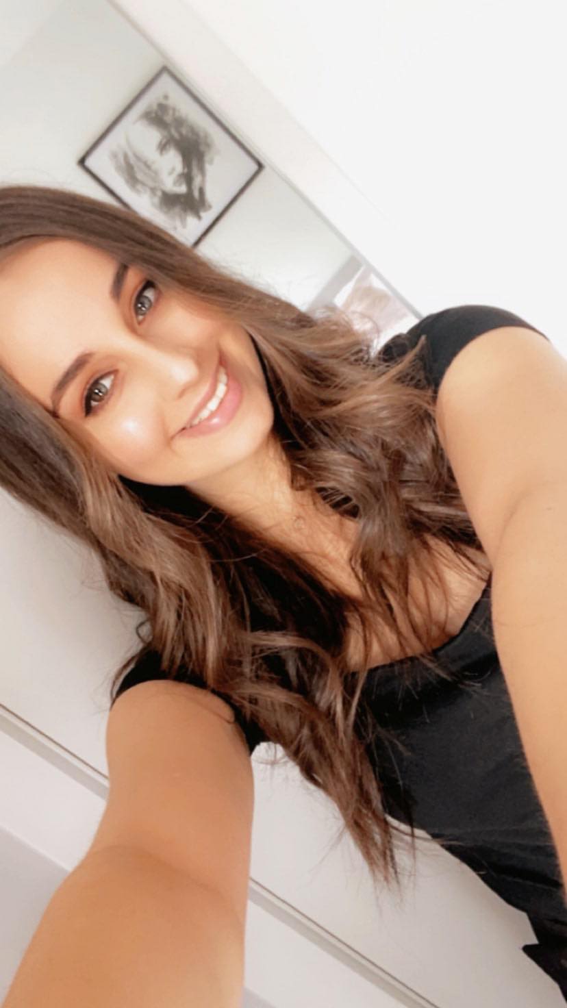 Celeste Manno smiles happily in a selfie.