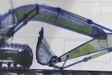 An x-ray picture of an excavator with many little visible packages in its arm.