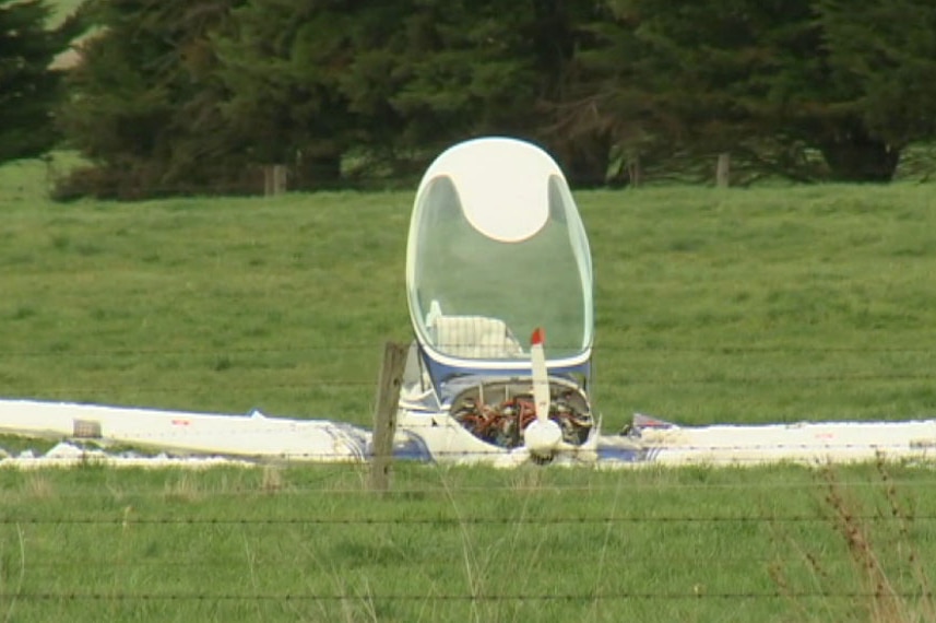 A crashed two seater glider on the ground at Clyde North.