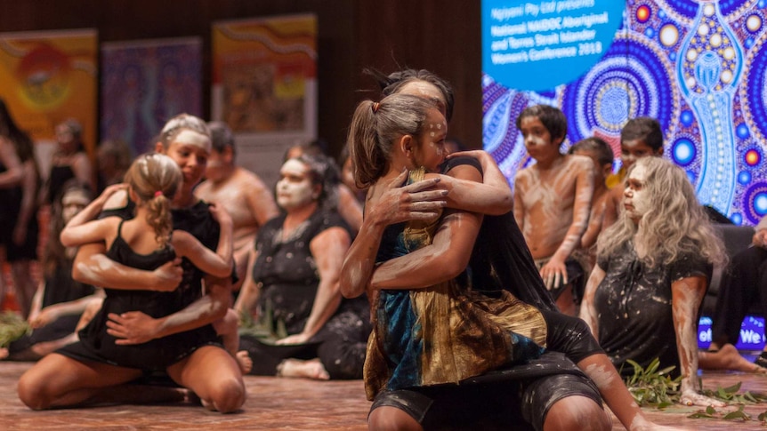 Women and children dance at the opening of the NAIDOC Women's Conference in Sydney