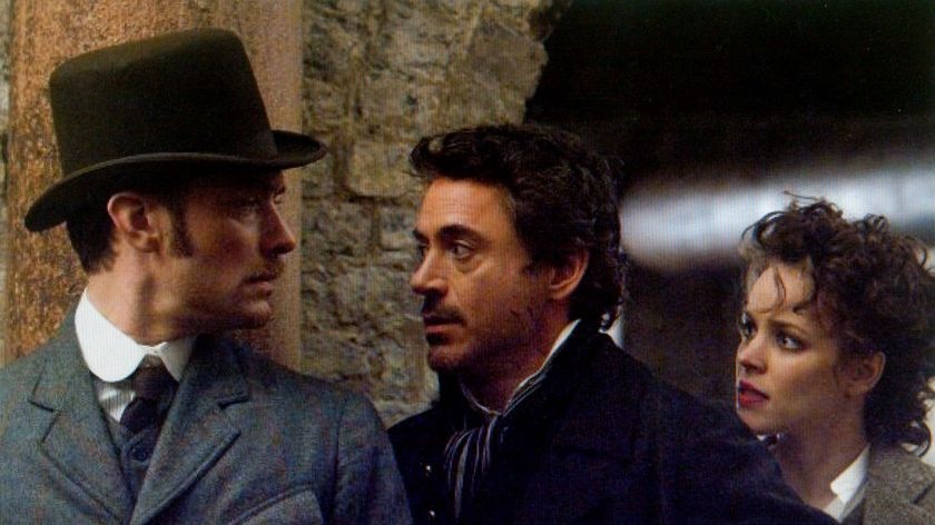 LtoR Jude Law, Robert Downey Jr and Rachel McAdams star in a scene from Sherlock Holmes