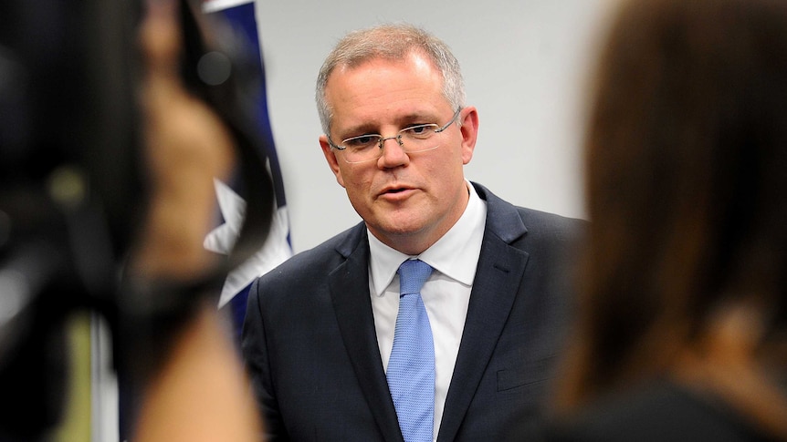 Scott Morrison with reporters on July 3, 2014.