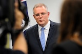 Scott Morrison with reporters on July 3, 2014.