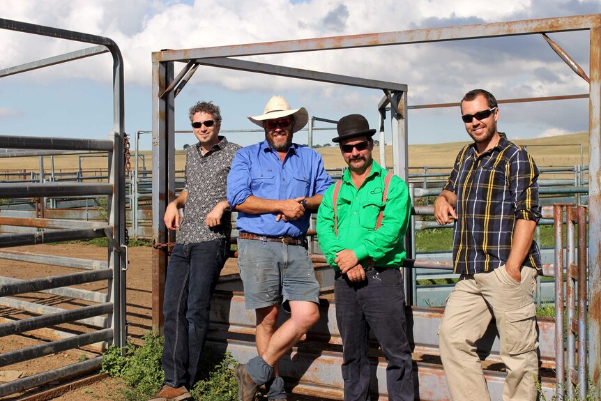 Crowd Carnivore team standing in cattle yards