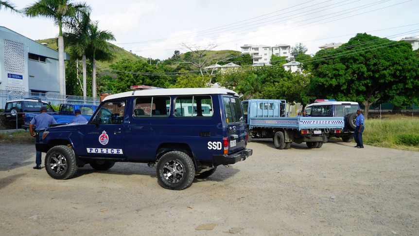 A Special Services Directorate police car in Papua New Guinea. It is a blue 4WD with the letters 'SSD' printed on it.