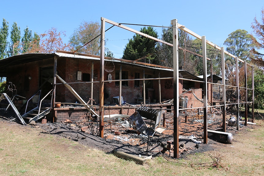 A house burnt and gutted by fire.