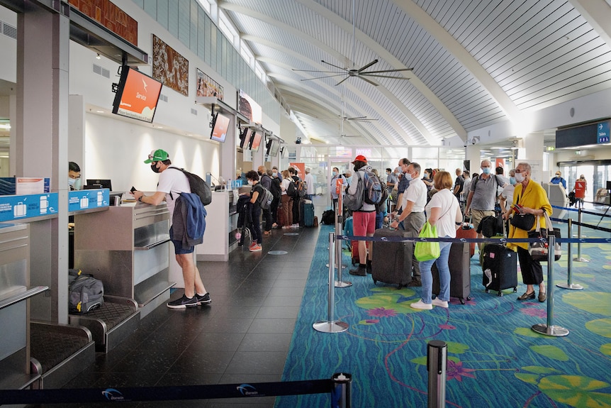 A long line at the Darwin Airport check-in counter during the COVID-19 lockdown.