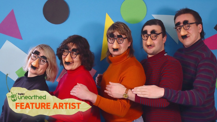 The five members of Zig Zag stand in height order wearing fake glasses and noses in front of a bright patterned background.