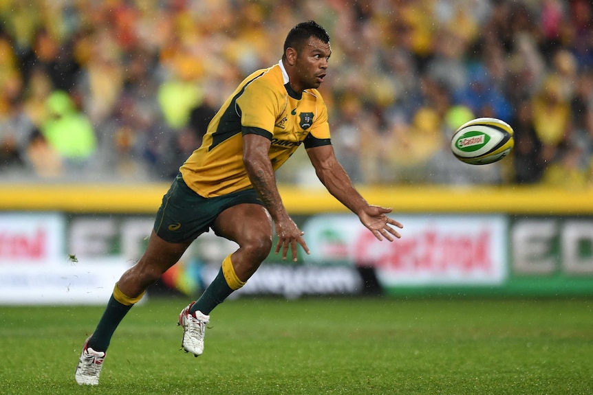 Kurtley Beale fires a pass for the Wallabies