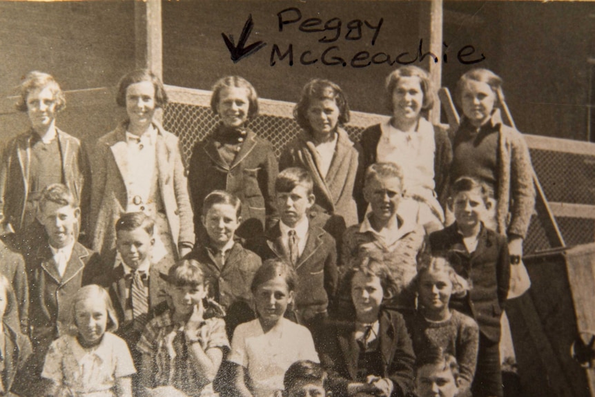 A school photo featuring Mrs Veale (top row, third from left).
