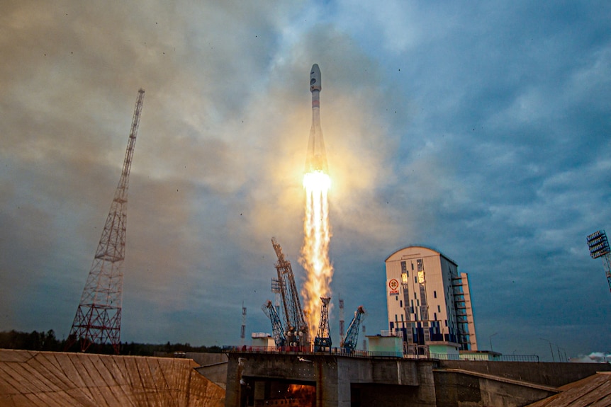Rocket launching into sky 