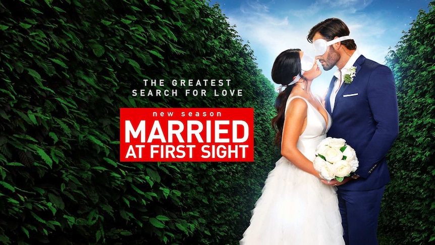 A blindfolded man and woman in wedding attire are almost kissing on this ad for Nine's Married At First Sight.