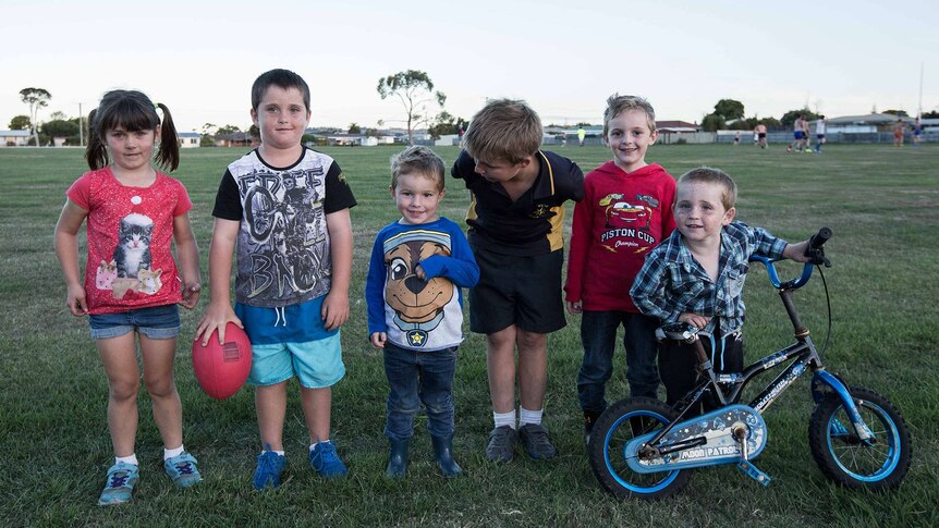 Kids on the boundary line at football training, northern Tasmania.