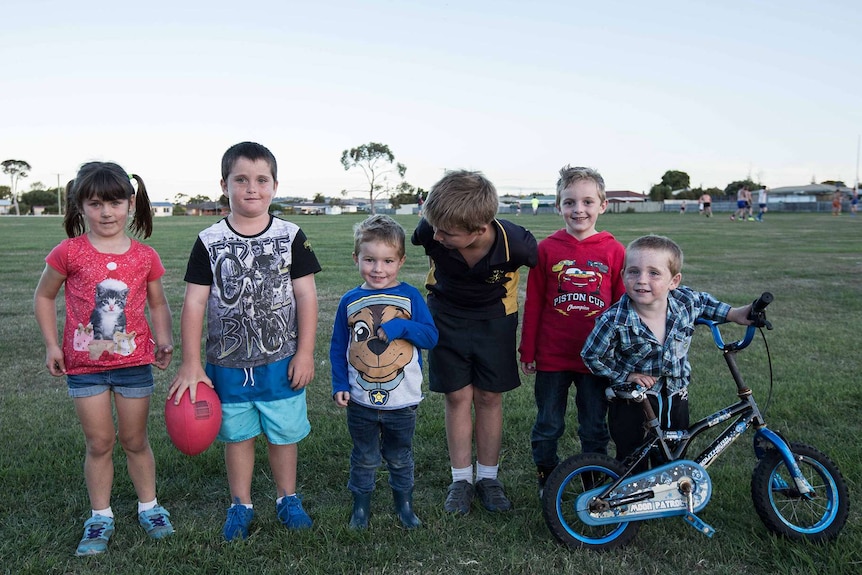 Kids on the boundary line at football training, northern Tasmania.