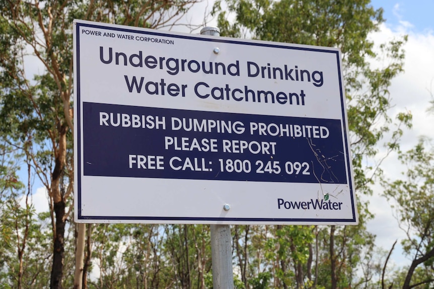 A sign near Koolpinyah aquifer says its an underground drinking water catchment area and warns that rubbish dumping is banned.