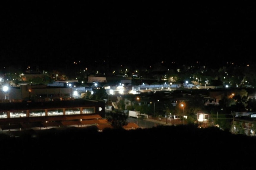 A drone image of Alice Springs at night.