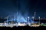 Carrara Stadium is lit up with blue lights for the opening ceremony.
