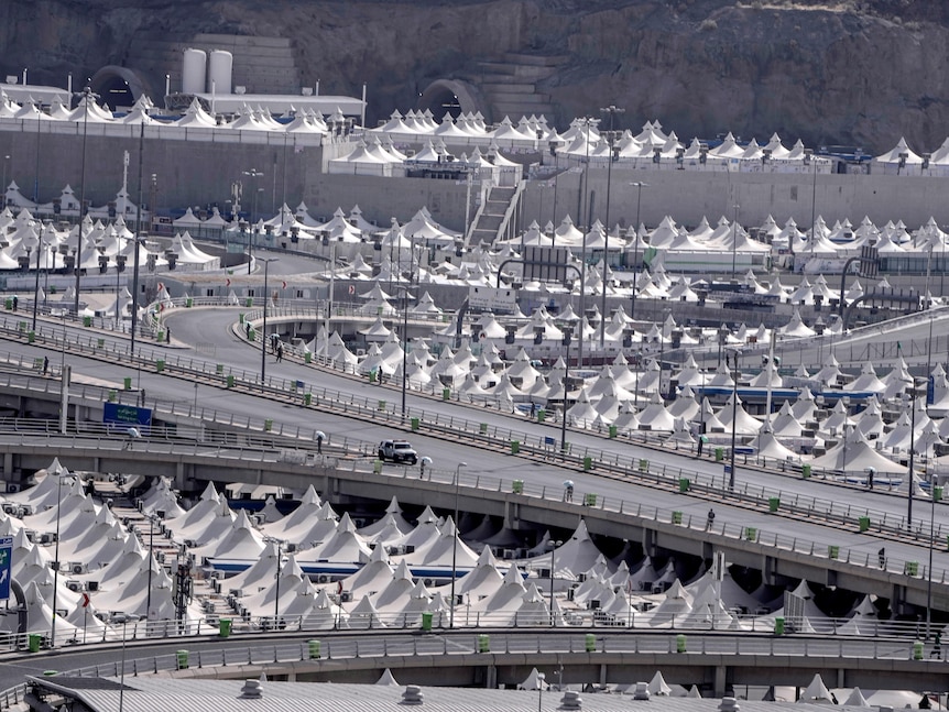Rows of tents surrounding highways