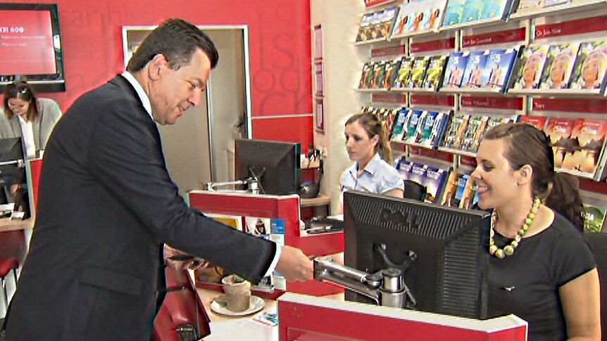 Nick Xenophon at a travel agent in Adelaide