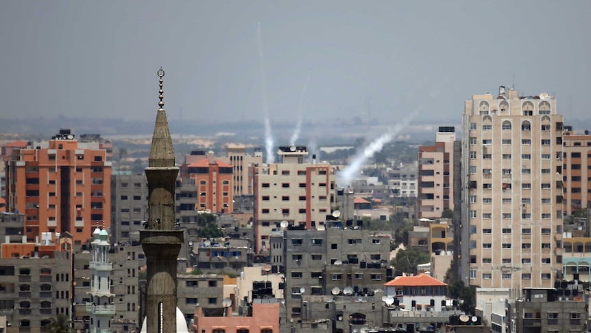 Smoke from rockets fired from Gaza City is seen after being launched toward Israel