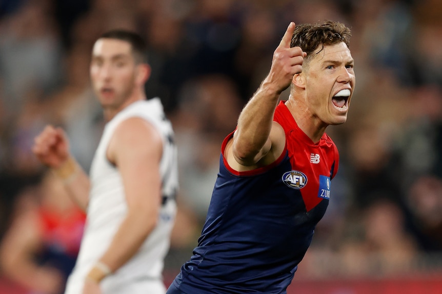 Jake Melksham celebrates by screaming and pointing at the sky