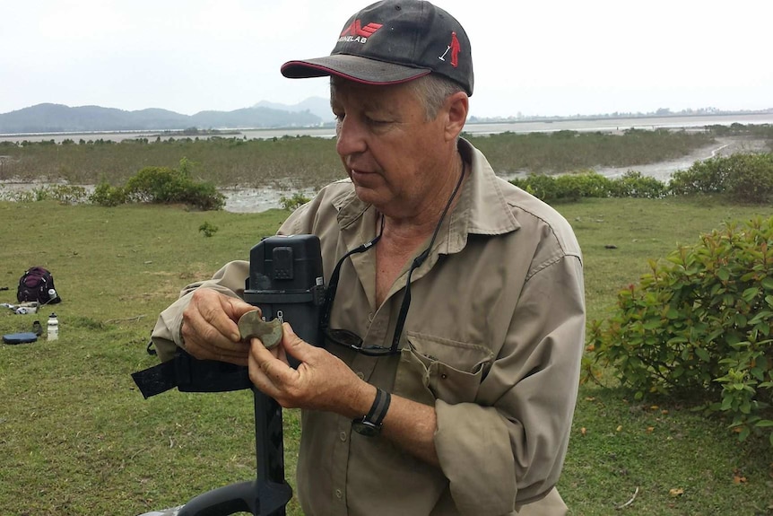 Bob Sheppard pictured on Quan Lan Island in Vietnam, holding a 3000-year-old polished stone axe.