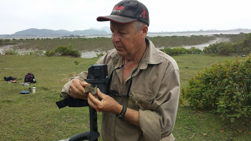 Bob Sheppard pictured on Quan Lan Island in Vietnam, holding a 3000-year-old polished stone axe.