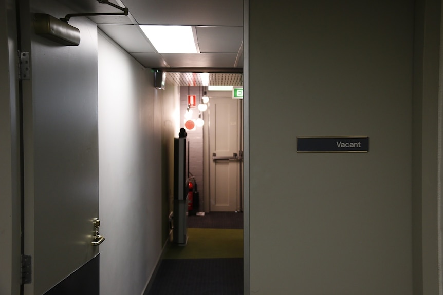 A door opening into a meeting room.