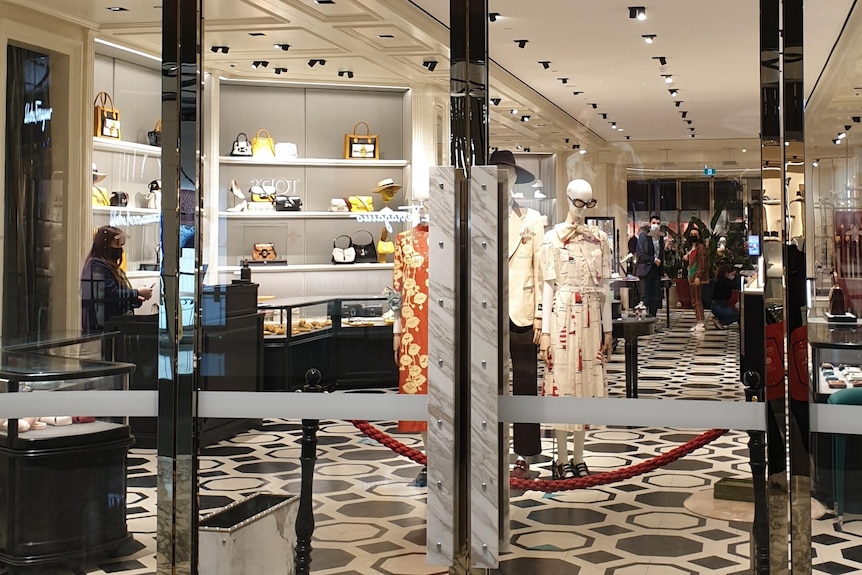 Inside a Gucci store, where high-end fashion is being sold during the Sydney lockdown.
