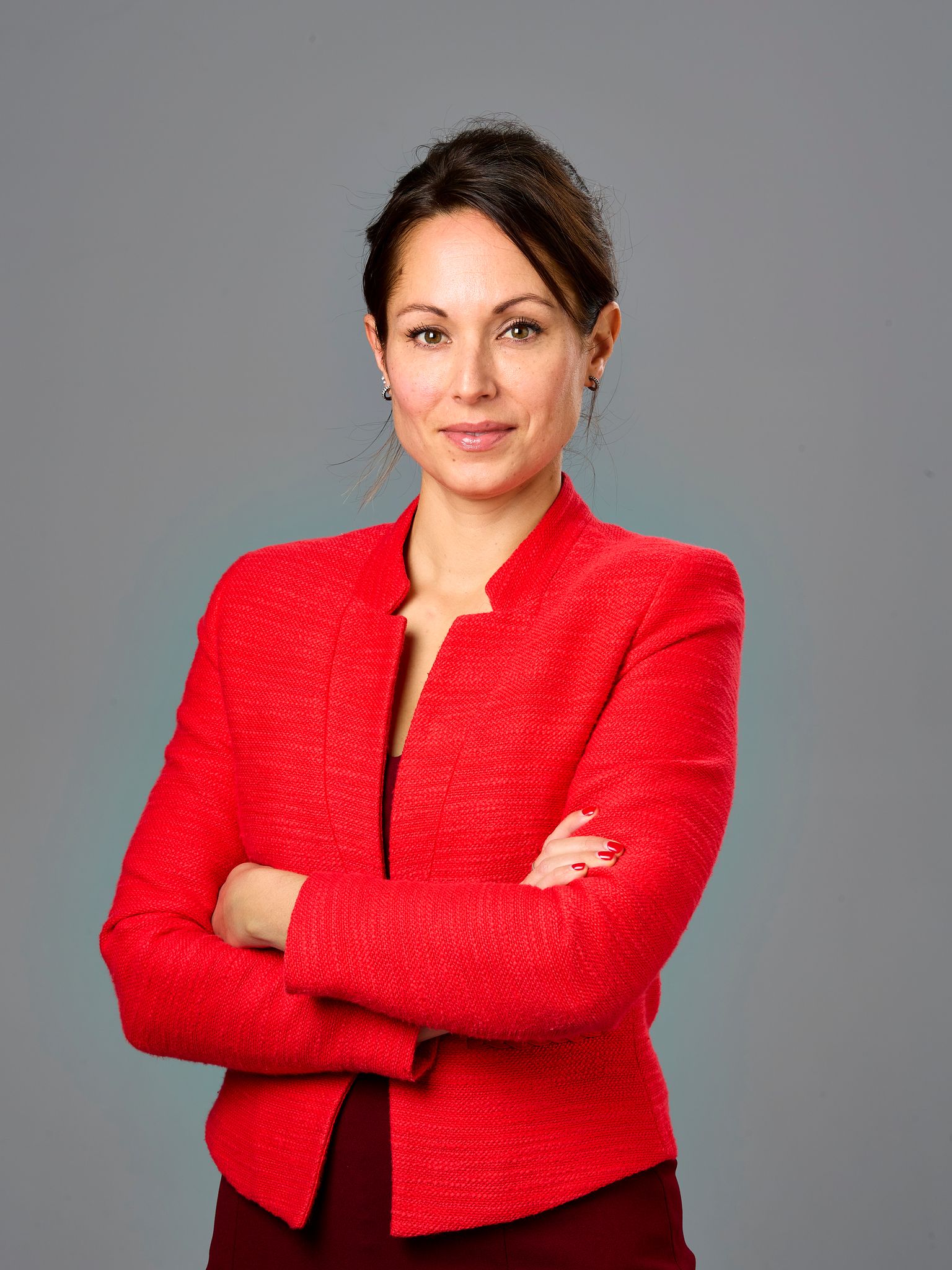 A woman in a red suit.
