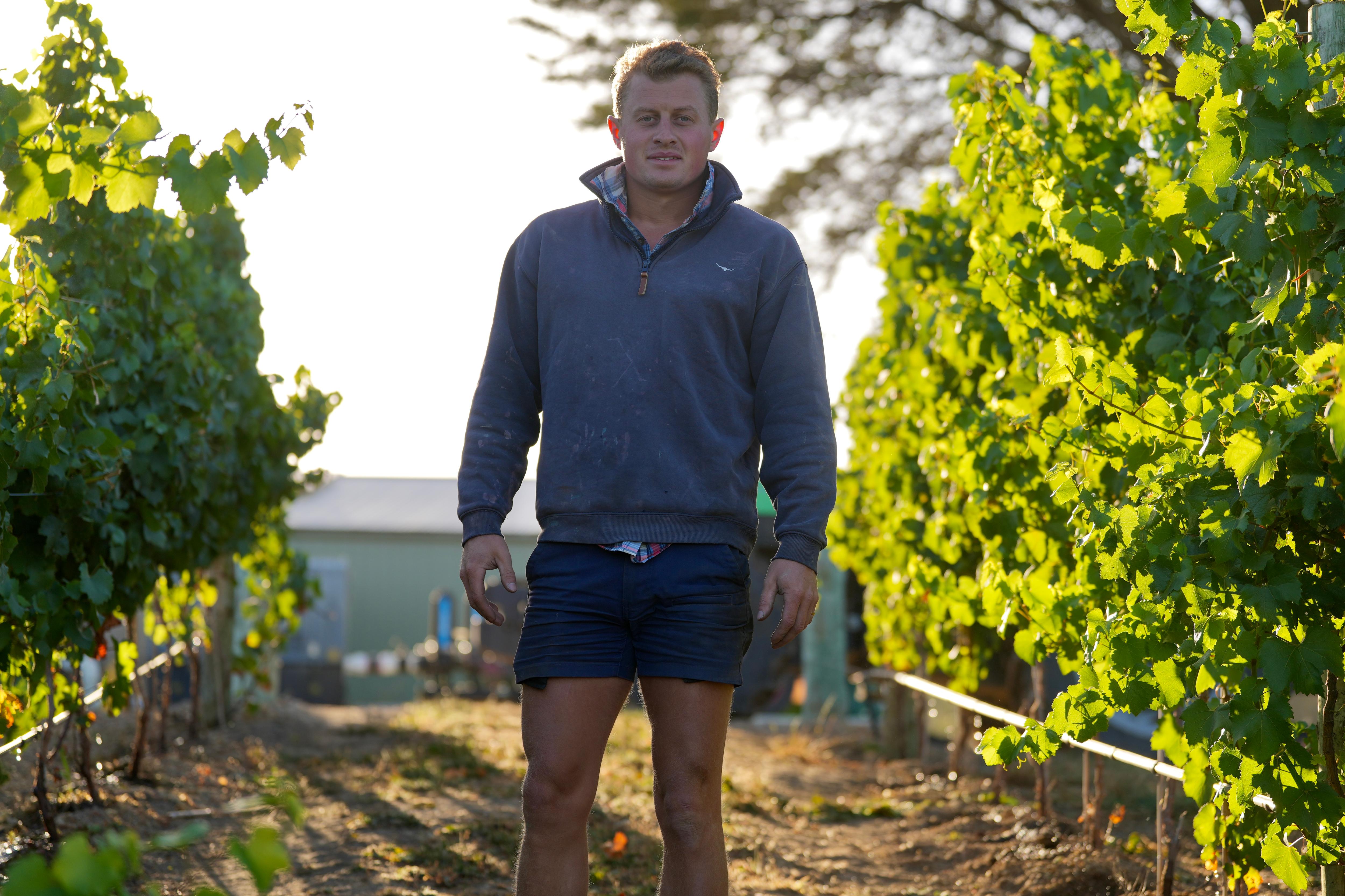 Jack Wilson standing in between the vines at his Adelaide Hills Vineyard
