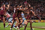 What a win ... Cameron Smith (R) lifts up Johnathan Thurston after the Maroons' win