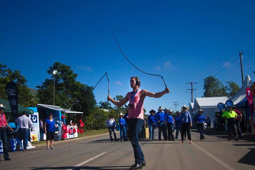 Whipcracking champion Nathan Griggs stops traffic at Beef Australia 2015 in Rockhampton.