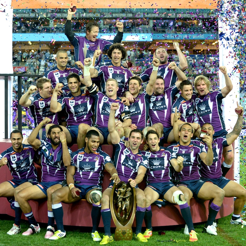 The Melbourne Storm celebrate their 14-4 grand final win over the Canterbury-Bankstown Bulldogs.