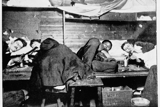 A photo of people lying in a Melbourne opium den smoking pipes, taken in 1896.