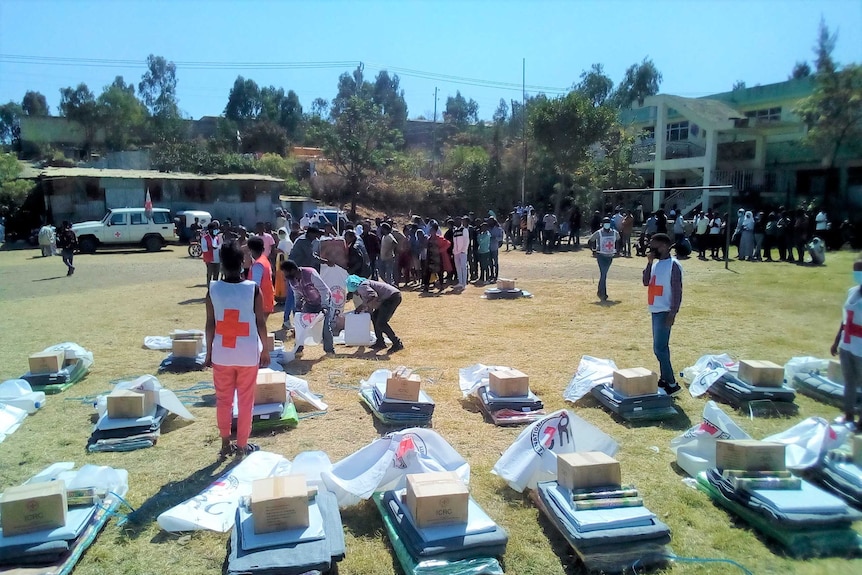 Aid workers distribute supplies to people in the Tigray region of Ethiopia